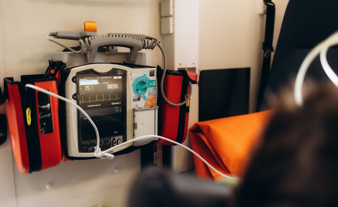 defibrillator on the table in the hospital near the patient's bed.